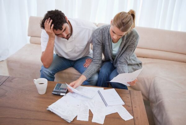 A couple in debt looking a bills